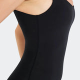 Close-up detail of onyx black pilot playsuit fabric texture and high-quality stitching.